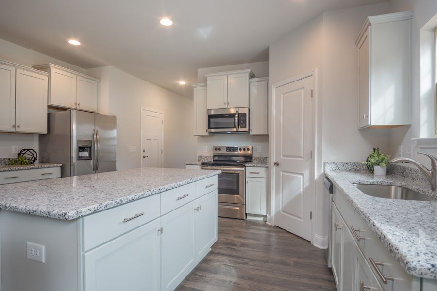 Representative furnished interior of a home built from the 3030 by Adams Homes in Parkland Place, Pace (Image 7).