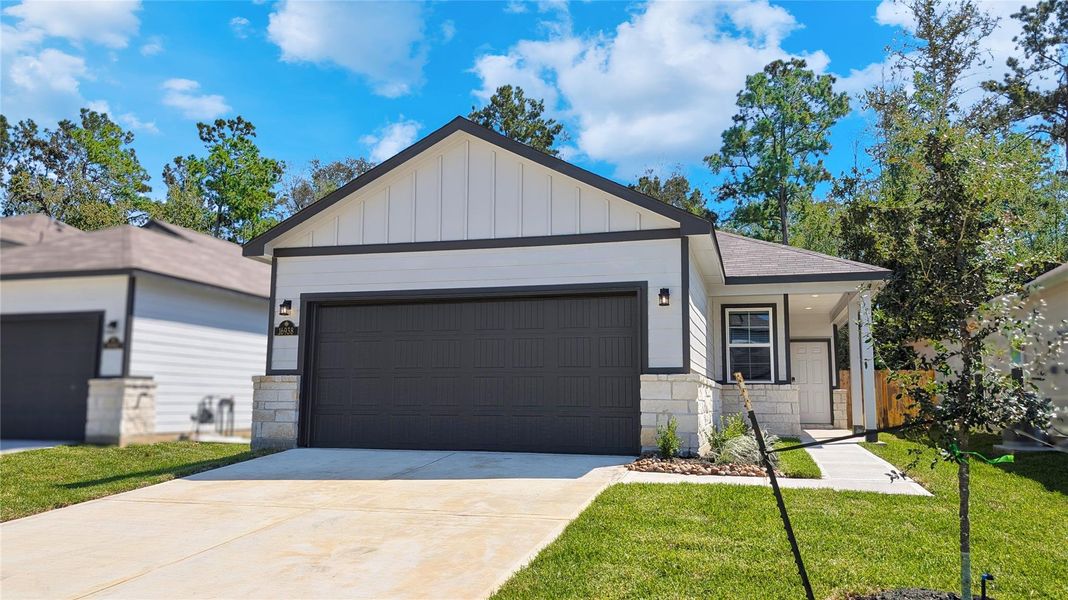 Front exterior of a new home in Maple Heights, Porter, TX, highlighting curb appeal (Image 13).