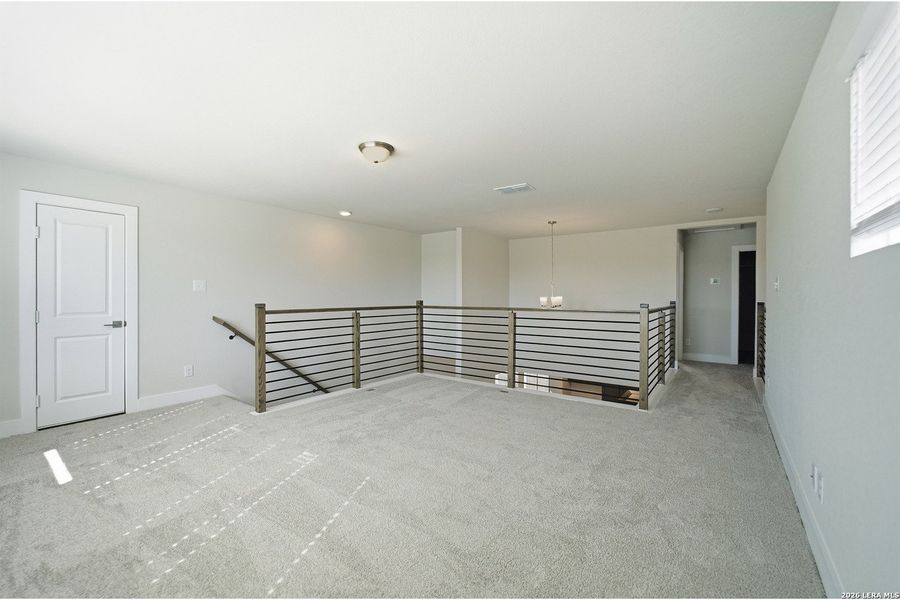 Spacious, unfurnished interior of a new home in The Woodlands at Medina Hills, Mico (Image 37).