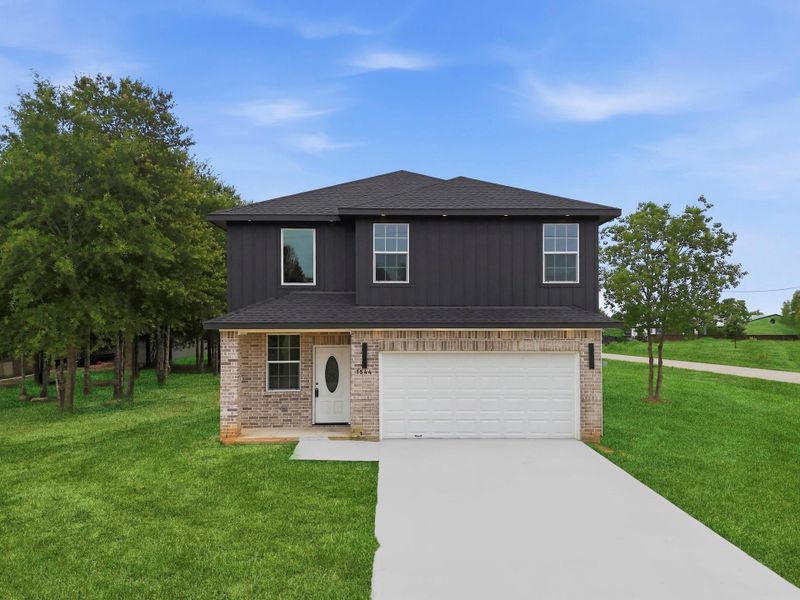 Front exterior of a new home in , Cleveland, TX, highlighting curb appeal (Image 30). Front exterior of a new home in , Cleveland, TX, highlighting curb appeal (Image 30).