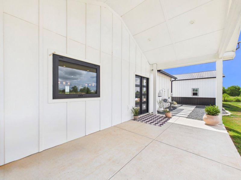 Spacious covered patio perfect for outdoor seating and entertaining