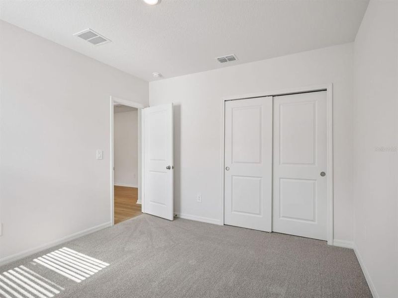 Spacious, unfurnished interior of a new home in The Grove at Stuart Crossing - Classic Series, Bartow (Image 14). Spacious, unfurnished interior of a new home in The Grove at Stuart Crossing - Classic Series, Bartow (Image 14).