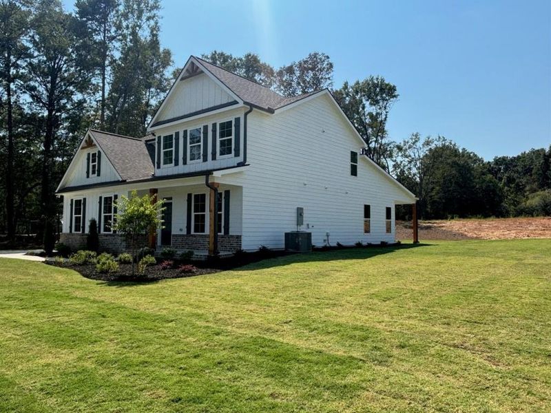 Front exterior of a new home in Pinegate, Covington, GA, highlighting curb appeal (Image 25). Front exterior of a new home in Pinegate, Covington, GA, highlighting curb appeal (Image 25).
