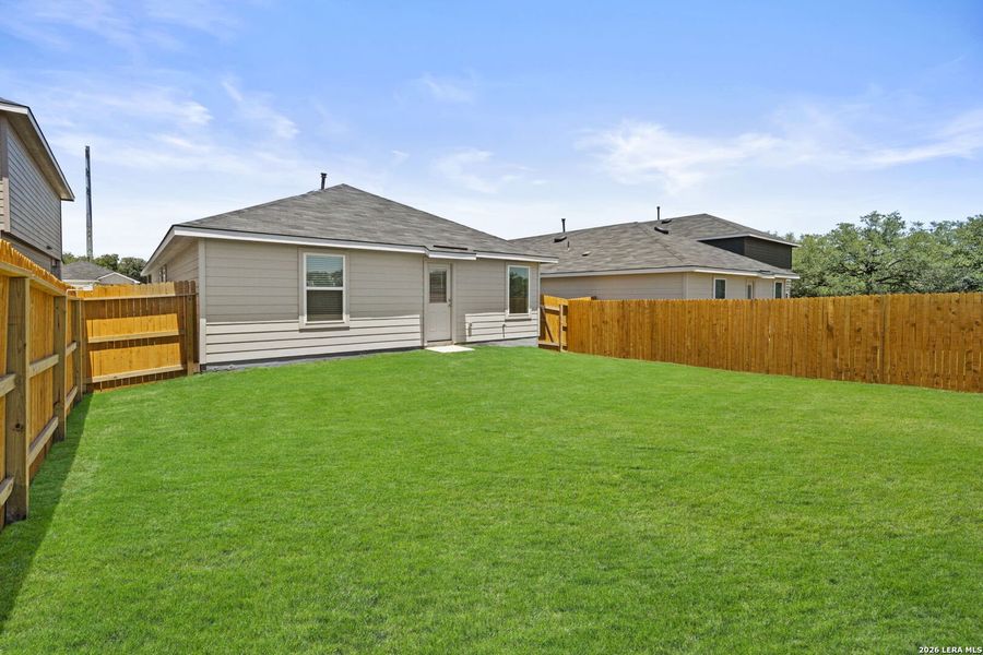 Exterior details and patio area of a home in Hickory Ridge, Elmendorf (Image 3).