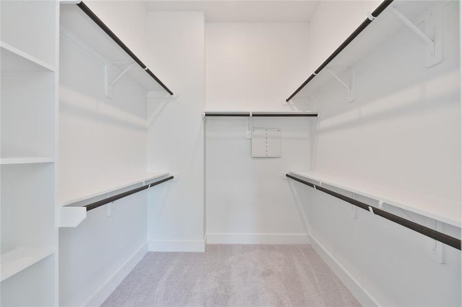 The walk-in closet, with shelving throughout, transforms storage into a dreamlike experience.