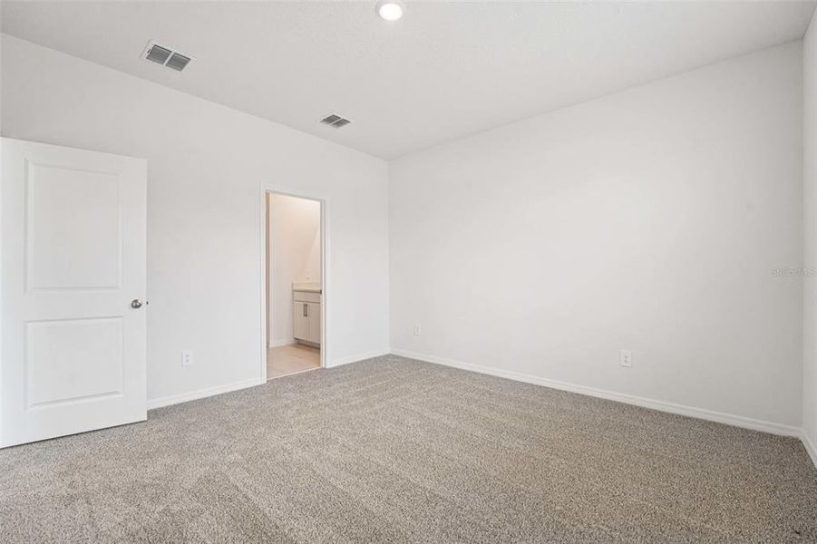 Spacious, unfurnished interior of a new home in The Grove at Stuart Crossing - Premier Series, Bartow (Image 18). Spacious, unfurnished interior of a new home in The Grove at Stuart Crossing - Premier Series, Bartow (Image 18).