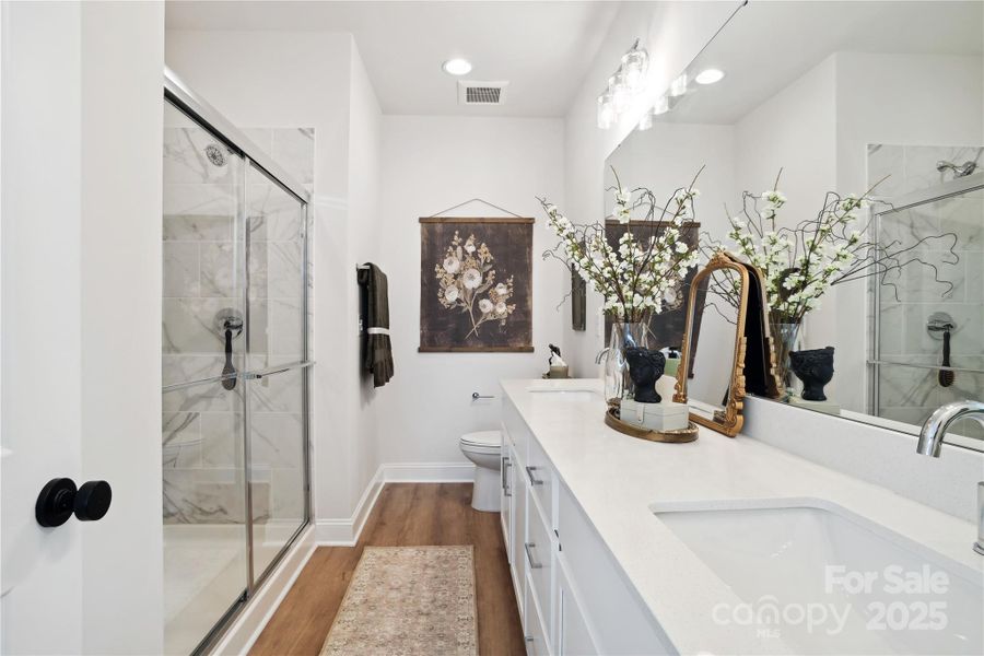 Primary Bathroom with oversized Double Vanity and Walk In Shower.