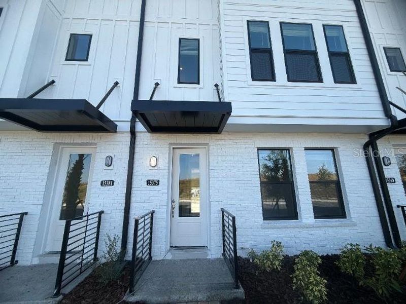 Exterior details and patio area of a home in Parkview at Hamlin, Winter Garden (Image 3).