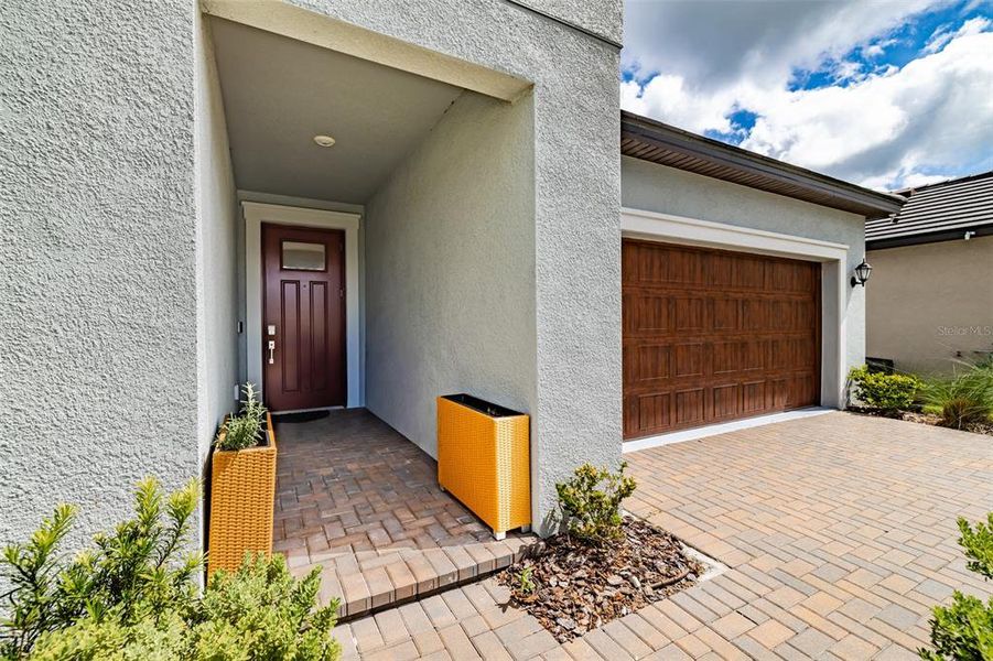 Exterior details and patio area of a home in Prosperity Lakes, Parrish (Image 31).