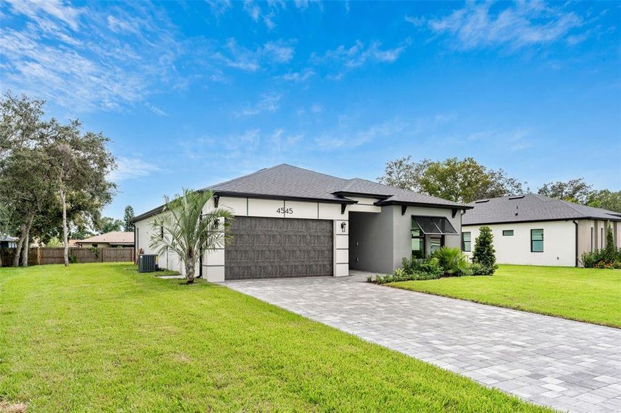 Front exterior of a new home in , Cocoa, FL, highlighting curb appeal (Image 1).