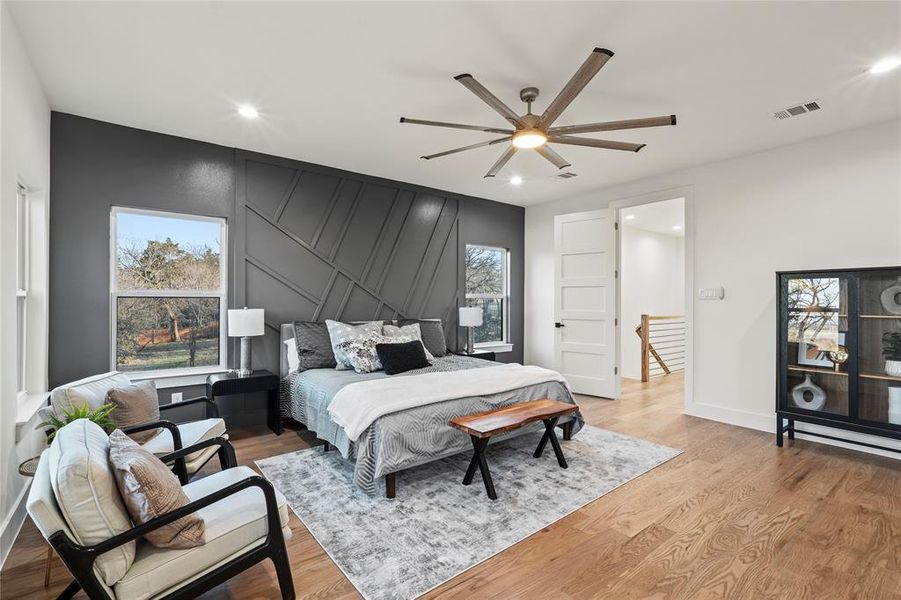 Bedroom featuring visible vents, multiple windows, light wood-style flooring, and recessed lighting