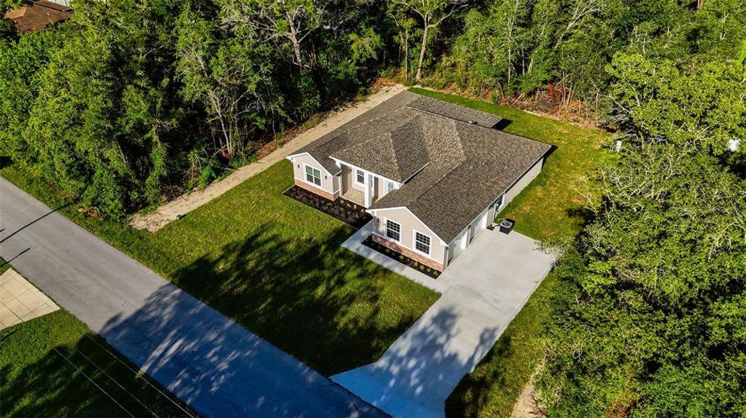 Front exterior of a new home in , Summerfield, FL, highlighting curb appeal (Image 21). Front exterior of a new home in , Summerfield, FL, highlighting curb appeal (Image 21).