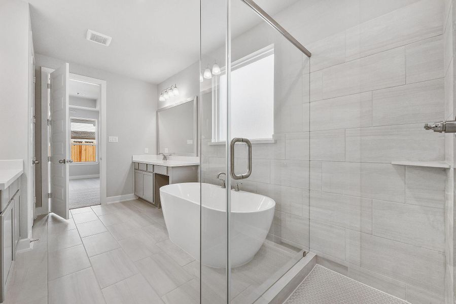 Furnished interior view inside a new home in Sunterra, Katy (Image 23).