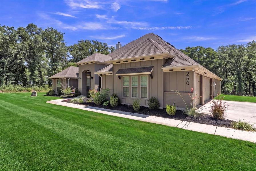 Front exterior of a new home in , Poolville, TX, highlighting curb appeal (Image 24). Front exterior of a new home in , Poolville, TX, highlighting curb appeal (Image 24).