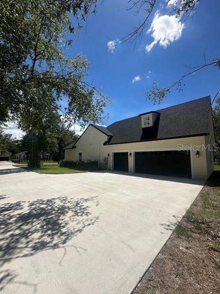 Front exterior of a new home in , Lake Helen, FL, highlighting curb appeal (Image 26).