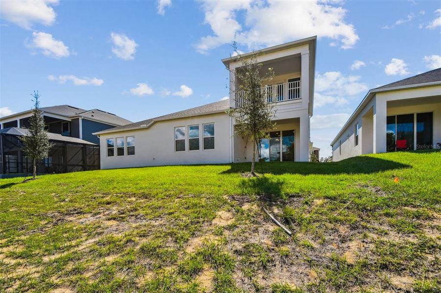 Exterior details and patio area of a home in Emerson Pointe, Apopka (Image 25).