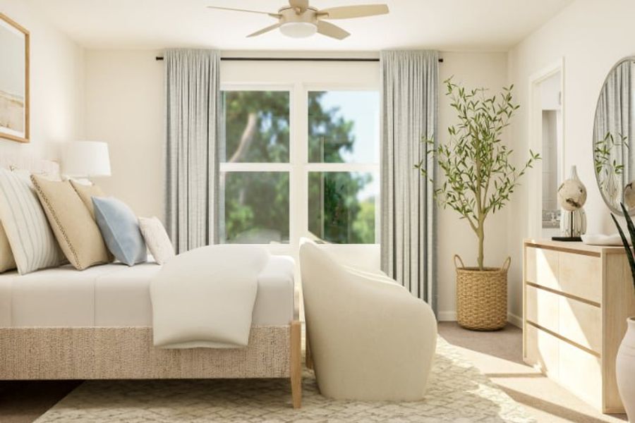 A living room with a couch and a fan.