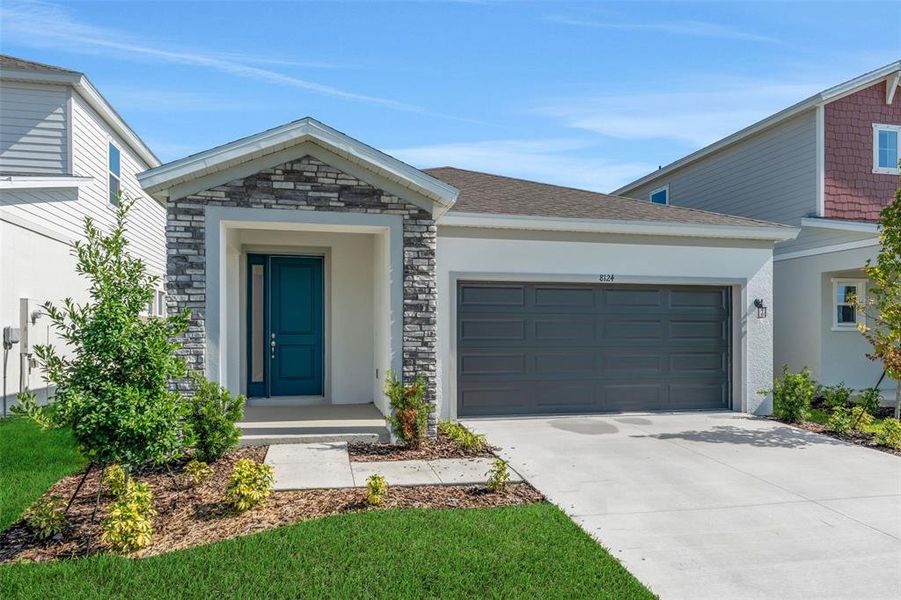 Front exterior of a new home in Seaire, Parrish, FL, highlighting curb appeal (Image 22).