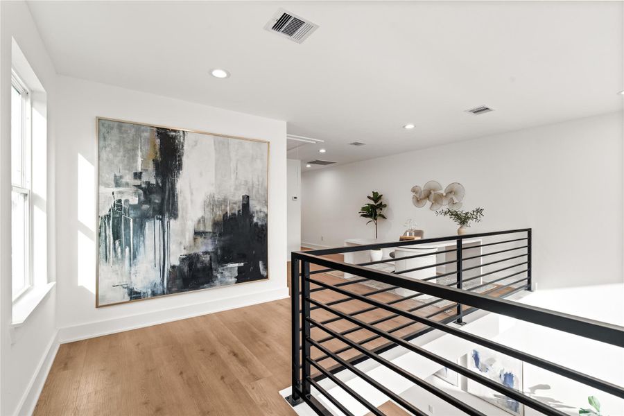 The lofted office stays connected to the rest of the home, overlooking the living room while still providing a dedicated place to focus. The lofted office stays connected to the rest of the home, overlooking the living room while still providing a dedicated place to focus.