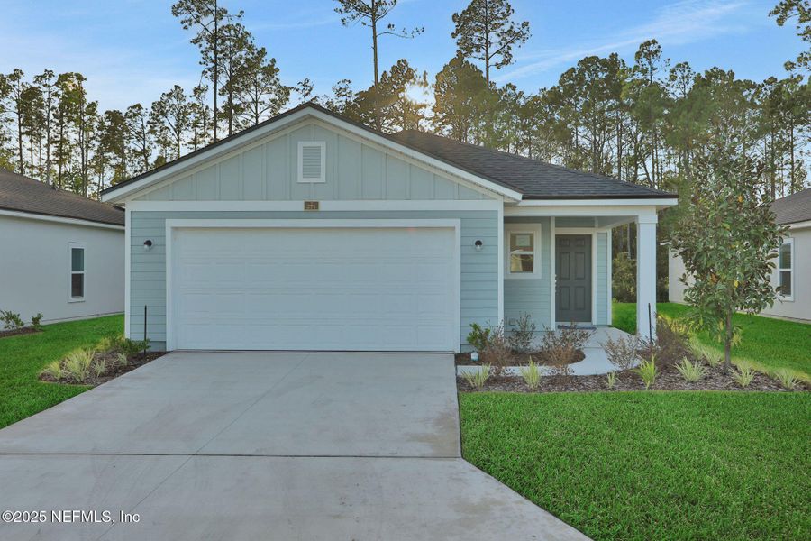 Front exterior of a new home in Cordova Palms, St. Augustine, FL, highlighting curb appeal (Image 1). Front exterior of a new home in Cordova Palms, St. Augustine, FL, highlighting curb appeal (Image 1).