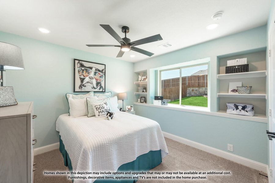 Bedroom with light blue walls, ceiling fan, built-in shelves, and a window overlooking the backyard Bedroom with light blue walls, ceiling fan, built-in shelves, and a window overlooking the backyard