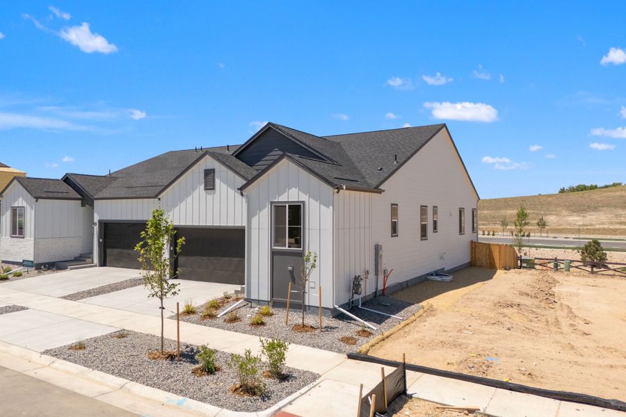 Front exterior of a new home in Trumark Homes at Tanterra, Parker, CO, highlighting curb appeal (Image 2). Front exterior of a new home in Trumark Homes at Tanterra, Parker, CO, highlighting curb appeal (Image 2).