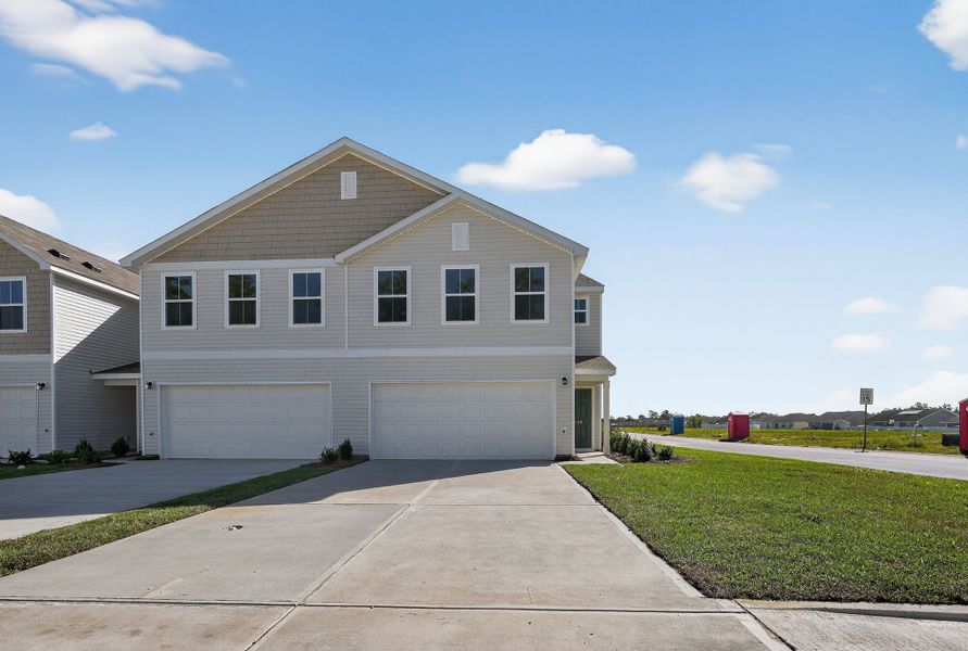 Front exterior of a new home in Graystone Townhomes, Florence, SC, highlighting curb appeal (Image 1).