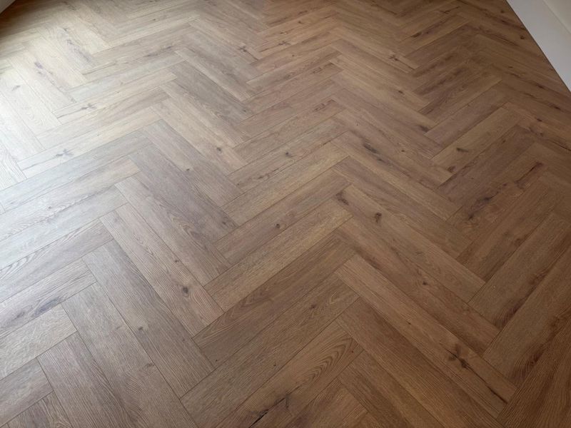 Chevron pattern floors throughout the ENTIRE home.