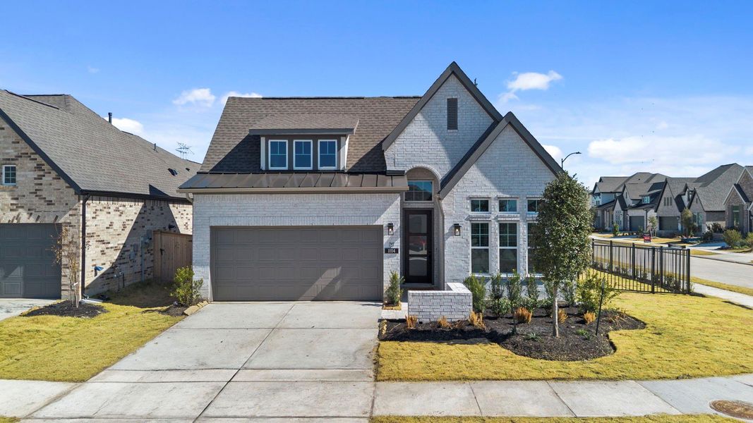 Front exterior of a new home in Bridgeland, Cypress, TX, highlighting curb appeal (Image 19). Front exterior of a new home in Bridgeland, Cypress, TX, highlighting curb appeal (Image 19).