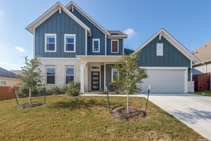 Front exterior of a new home in Sunfield, Buda, TX, highlighting curb appeal (Image 24). Front exterior of a new home in Sunfield, Buda, TX, highlighting curb appeal (Image 24).