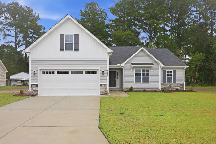 Front exterior of a new home in Davenport Farms, Winterville, NC, highlighting curb appeal (Image 20). Front exterior of a new home in Davenport Farms, Winterville, NC, highlighting curb appeal (Image 20).