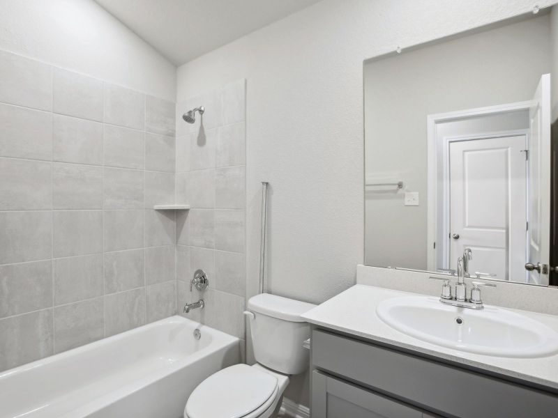 This full secondary bathroom makes getting ready easier for everyone.