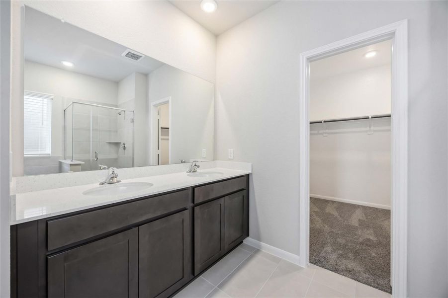 Furnished interior view inside a new home in Sunterra, Katy (Image 11).