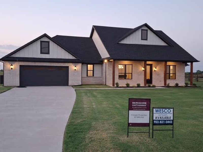 Front exterior of a new home in , Van Alstyne, TX, highlighting curb appeal (Image 1).