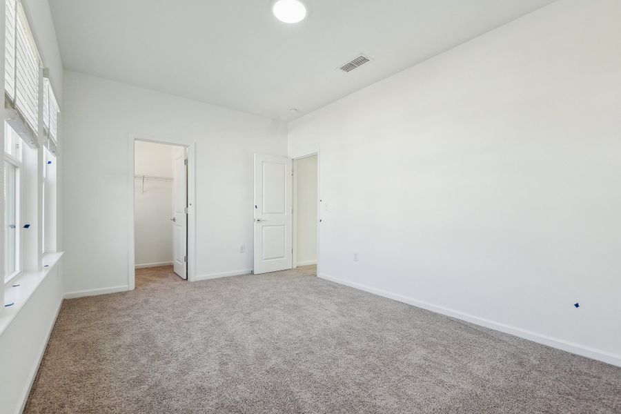 Representative unfurnished interior of a home built from the Macon by Ashton Woods in Rowland's Grant, Fuquay Varina (Image 36).
