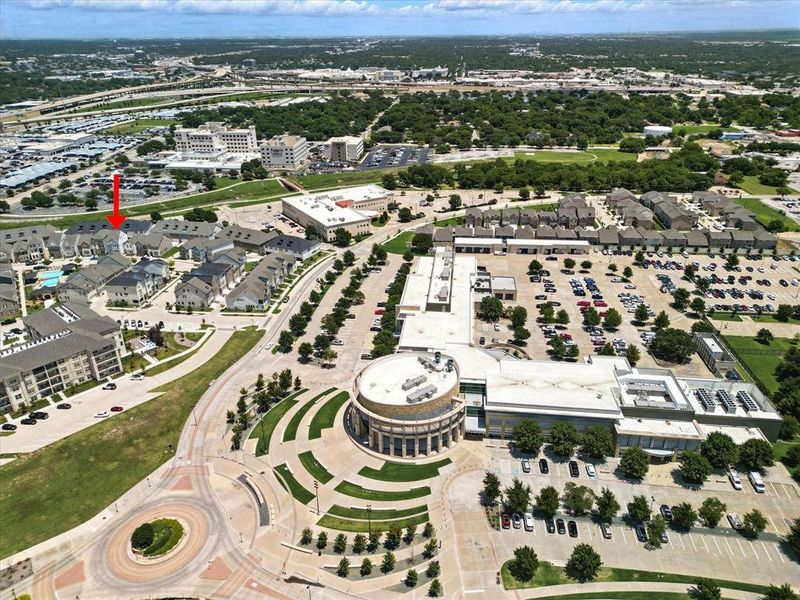 Your home is identified. An aerial view of City Hall, a Medical Center in the background and the neighborhood