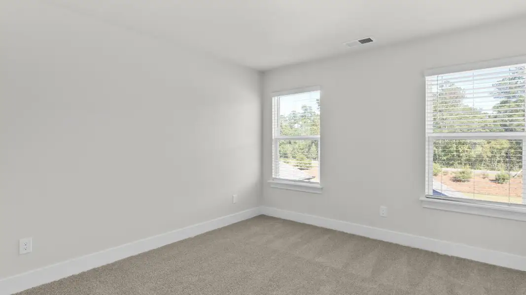 Spacious, unfurnished interior of a new home in The Highlands at Cedar Hill Landing, Navassa (Image 27).