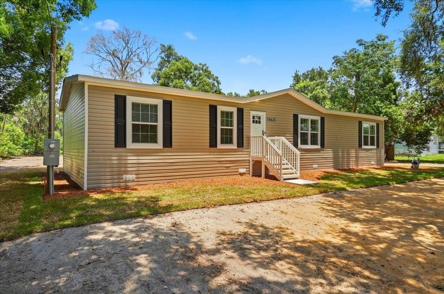 Exterior details and patio area of a home in , Zephyrhills (Image 25).