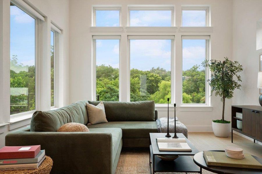 Floor-to-ceiling windows provide a captivating view, bathing the living space in natural light. Floor-to-ceiling windows provide a captivating view, bathing the living space in natural light.