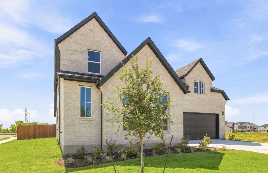 Front exterior of a new home in Kuempel Estates, Pflugerville, TX, highlighting curb appeal (Image 25).