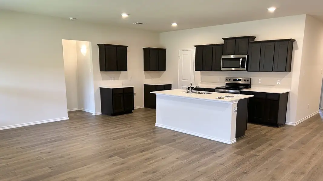 Representative furnished interior of a home built from the GARLAND by D.R. Horton in Northspur, Forney (Image 5).