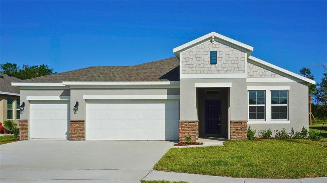 Front exterior of a new home in Archers Mill, Ormond Beach, FL, highlighting curb appeal (Image 1). Front exterior of a new home in Archers Mill, Ormond Beach, FL, highlighting curb appeal (Image 1).