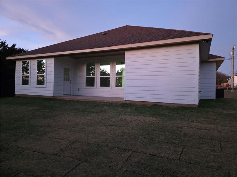 Picture of covered back porch and back of structure house.