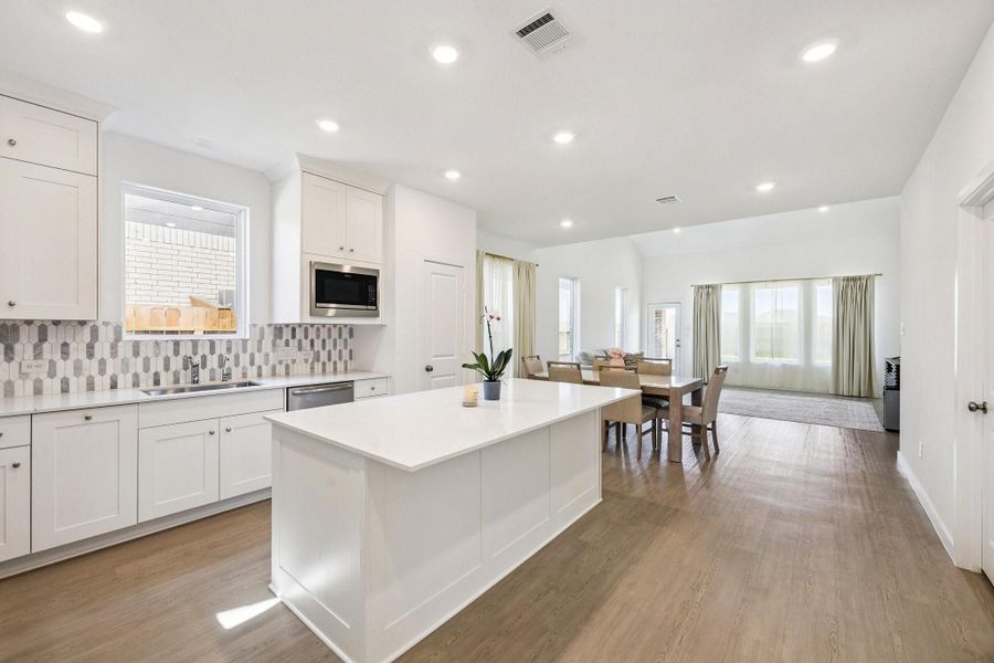 As soon as you enter, you are greeted by a bright and airy beautiful and sleek modern kitchen. As soon as you enter, you are greeted by a bright and airy beautiful and sleek modern kitchen.