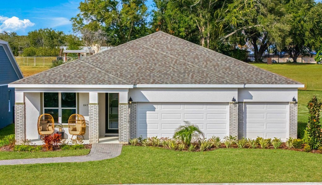 Representative exterior photo of a completed home built from the Everly by Hartizen Homes in Eden Crest Single Family Homes, Apopka, FL (Image 27).