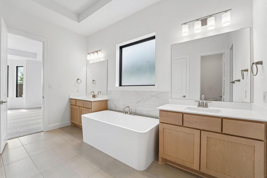 Furnished interior view inside a new home in Del Bello Lakes 60', Manvel (Image 11).