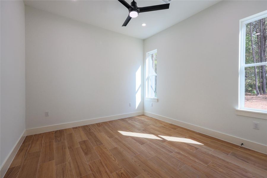 Bedroom with walk in closet with space for clothes and even built in custom shoe racks. Bedroom with walk in closet with space for clothes and even built in custom shoe racks.