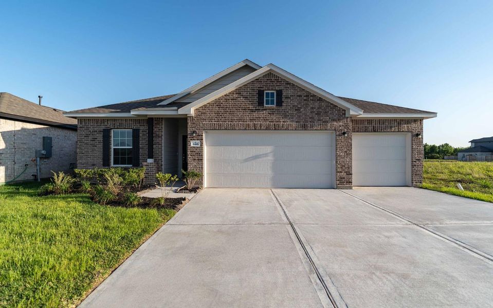 Front exterior of a new home in River Ranch Meadows, Dayton, TX, highlighting curb appeal (Image 1).