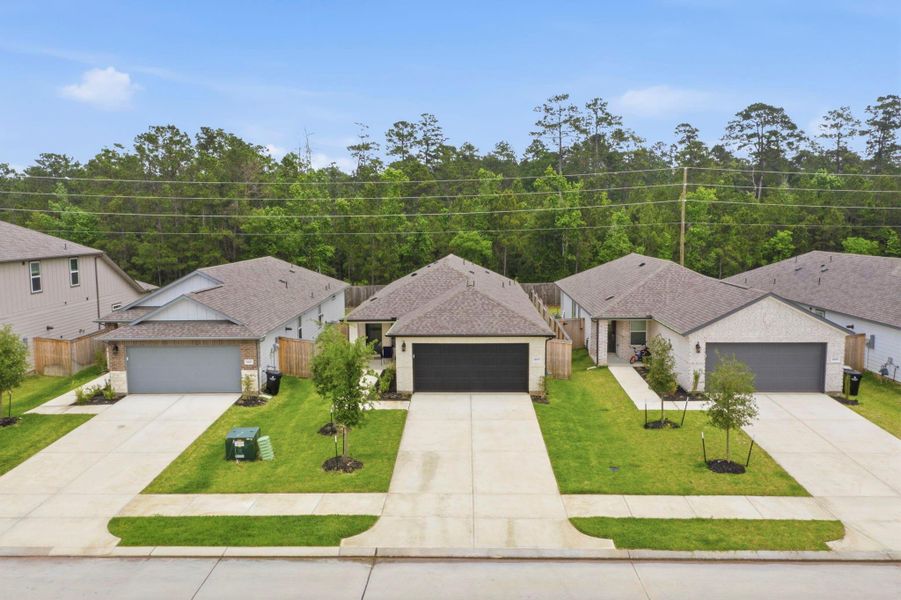 Front exterior of a new home in Mavera, Conroe, TX, highlighting curb appeal (Image 2). Front exterior of a new home in Mavera, Conroe, TX, highlighting curb appeal (Image 2).