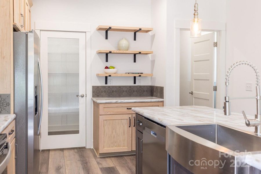 Stylish kitchen with full size walk in pantry